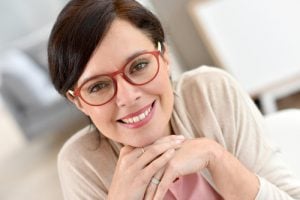 'woman smiling after bone graft'